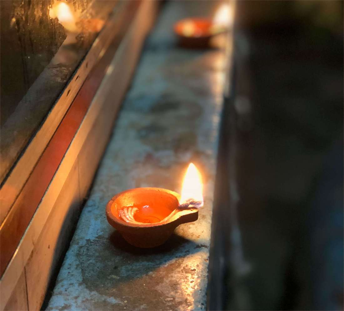 A flame in a clay lamp