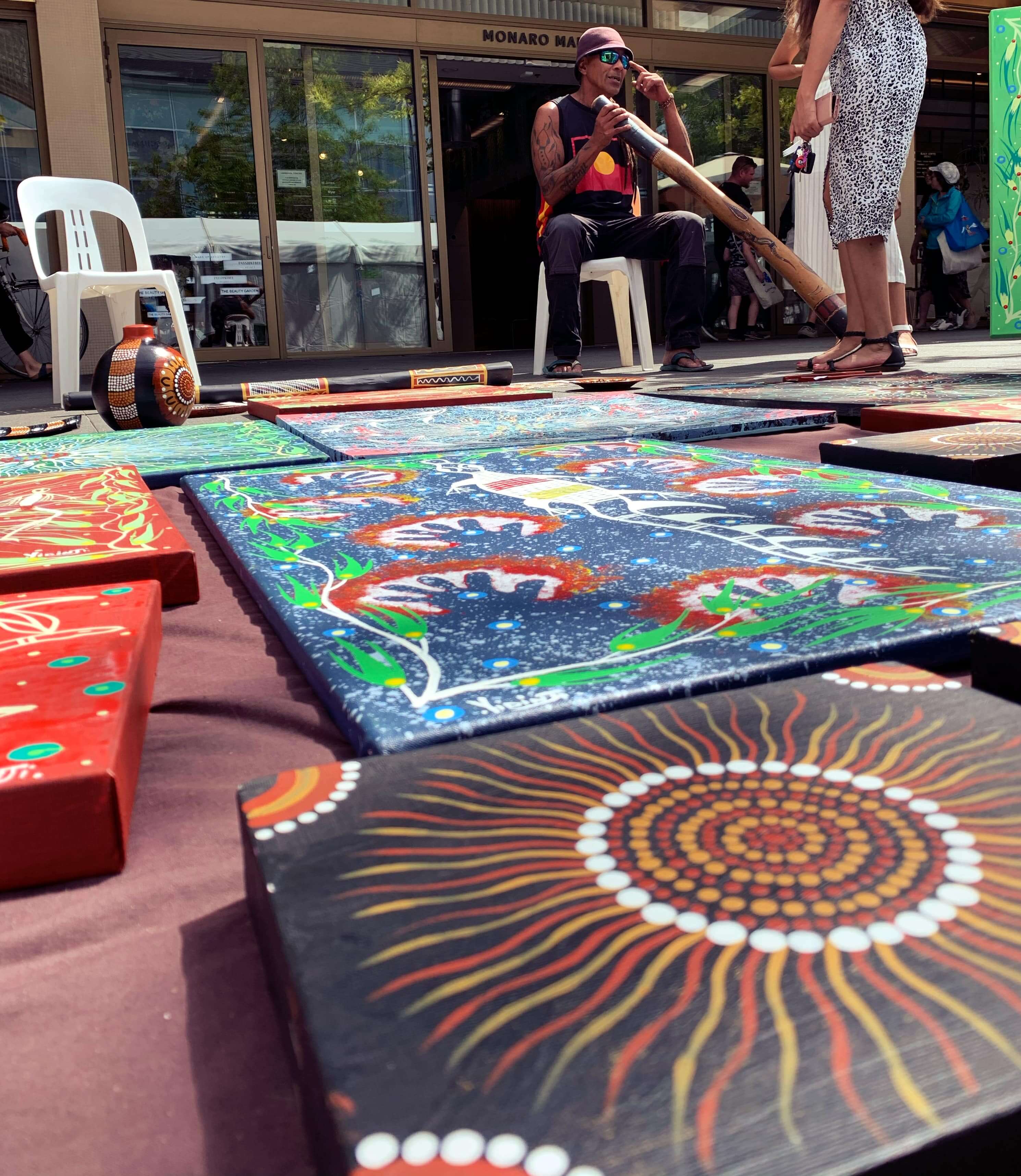 Artist with his paintings, National Multicultural Festival 2020