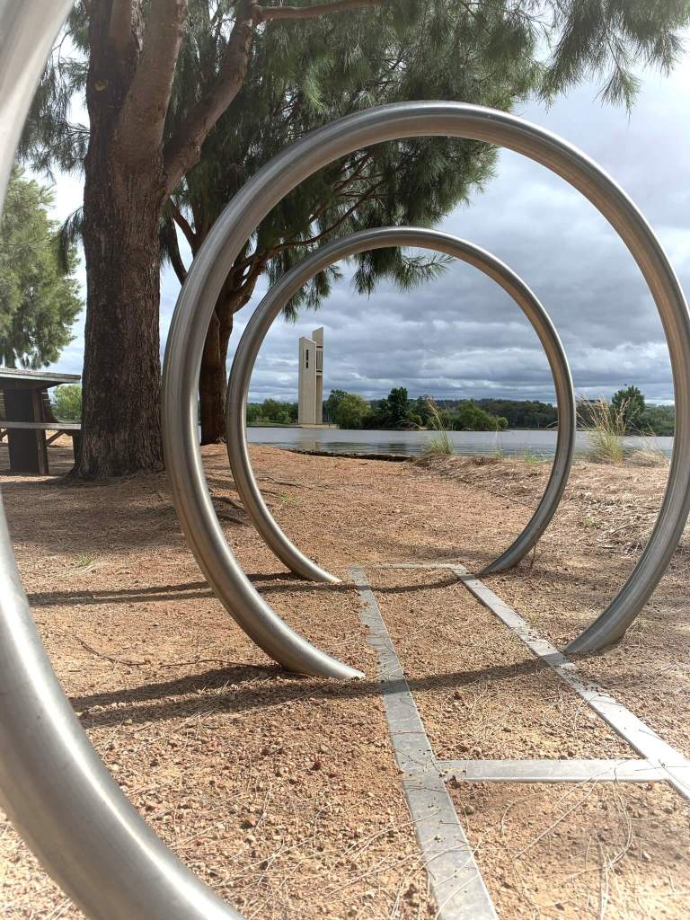 The National Carillon, as seen through bicycle parking stands, Canberra