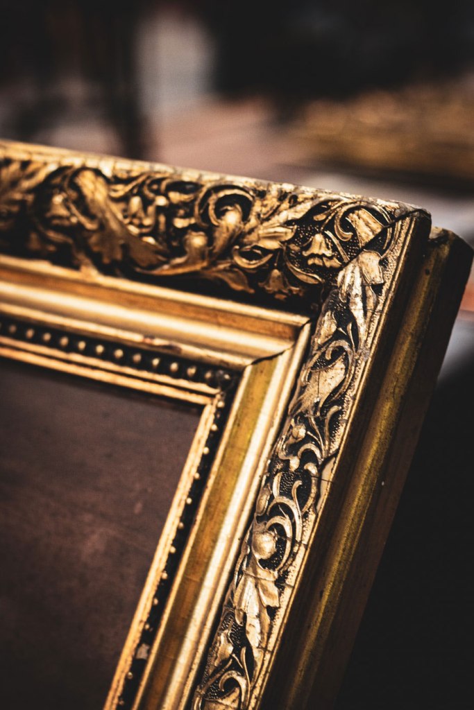 a golden picture frame - Unsplash