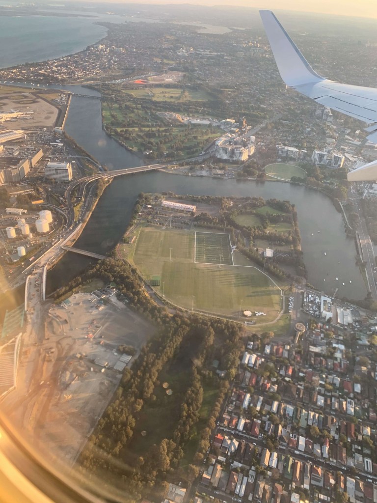 Photo of Adelaide city, as seen from the window seat of an airplane, as it comes in for landing. 