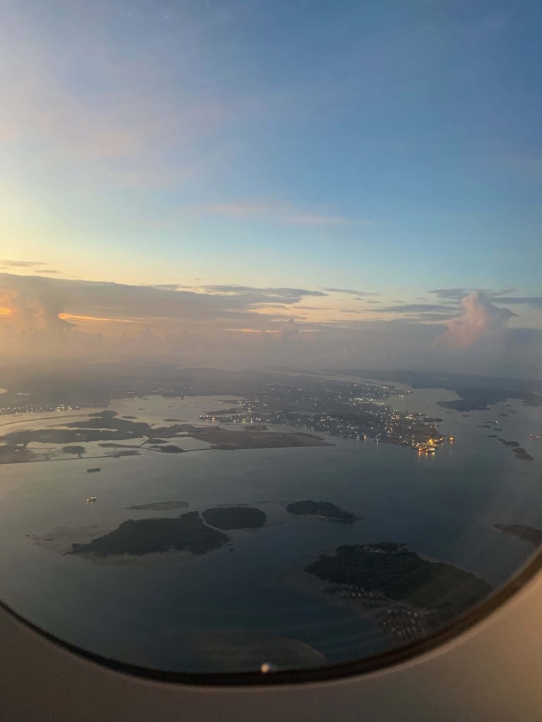 Photo of the islands of Singapore as seen from an airplane window. 