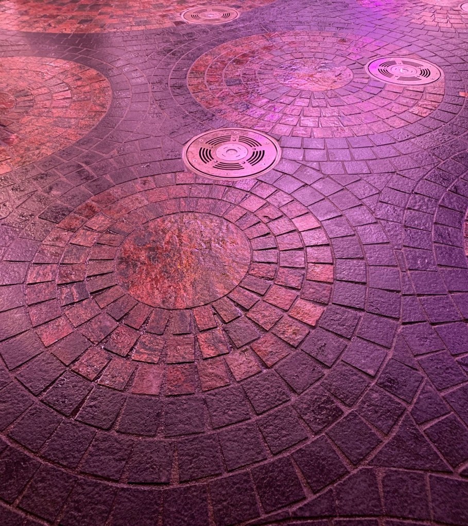 Close up photo of circular ground tile placement.   