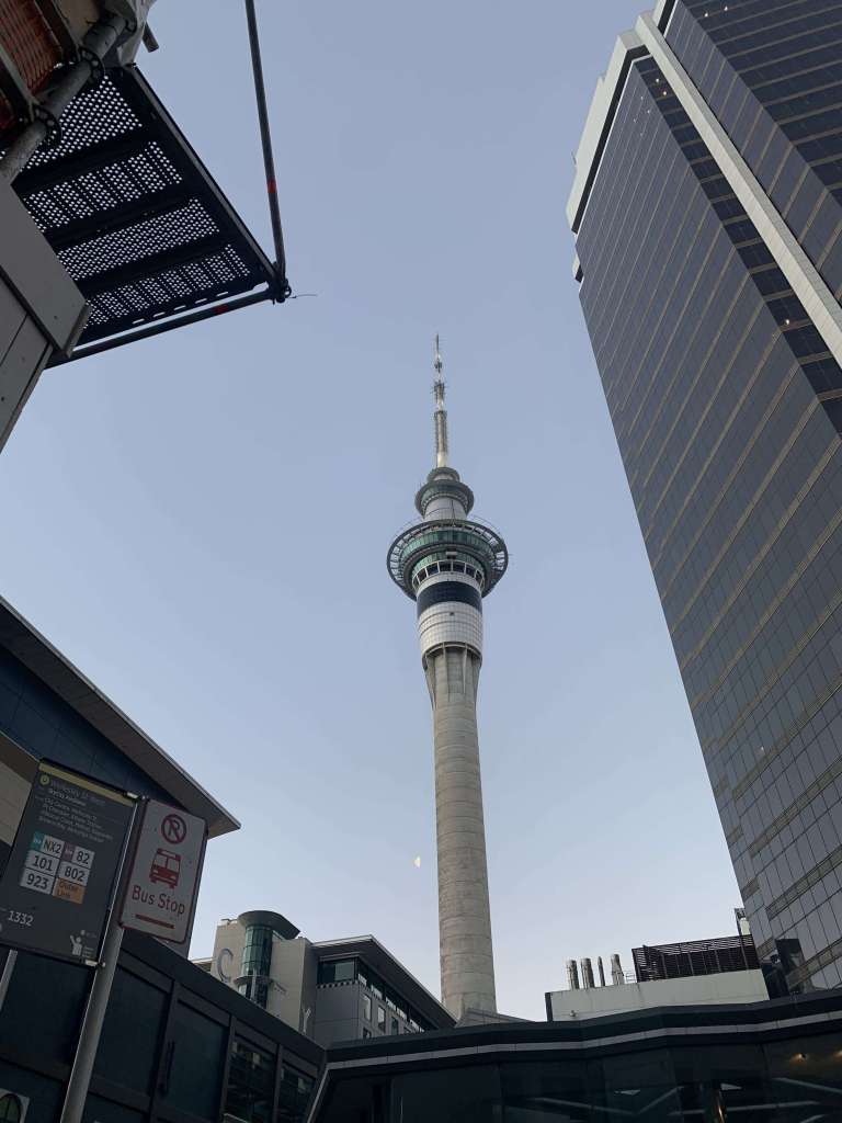 photo of the Skycity tower in Auckland and a waning moon next to it