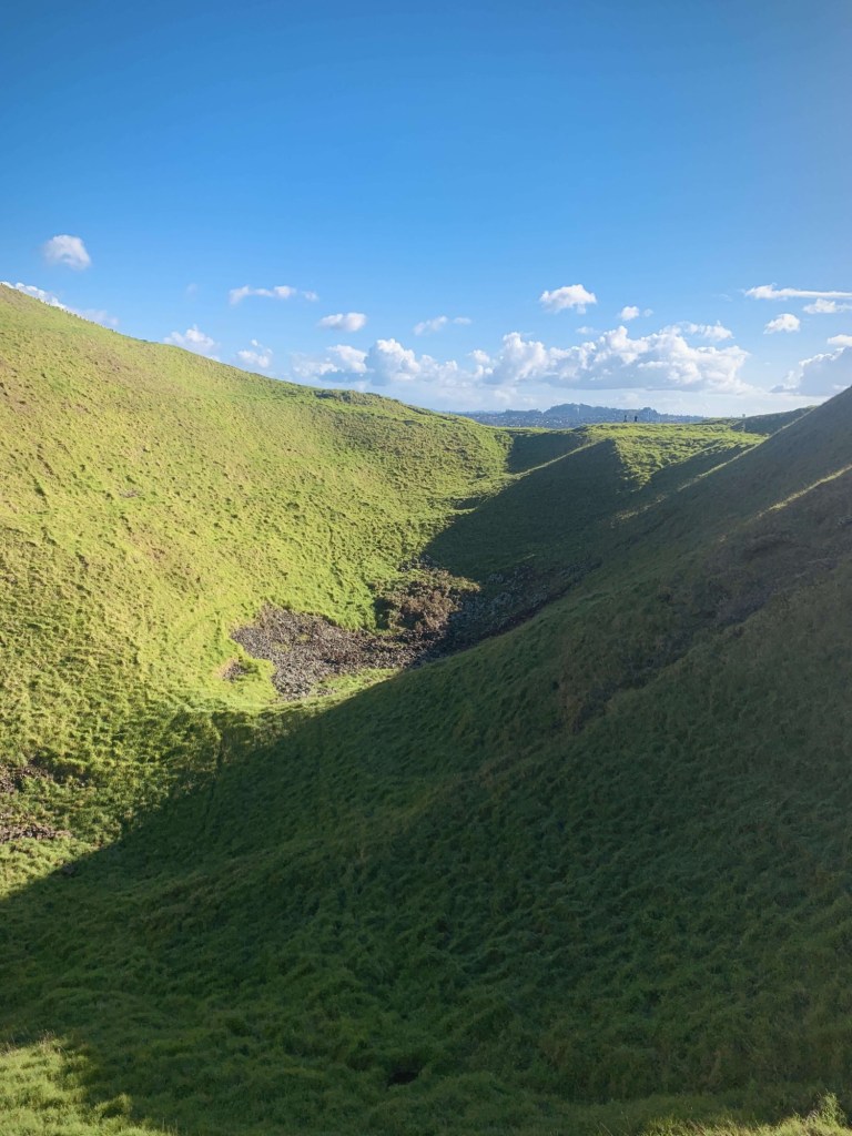 Photo of the crater of a dormant volcano, as seen from the top of the volcano. 