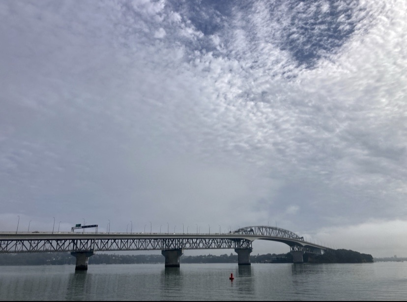Photo of the Auckland harbour bridge, as seen from the other side.